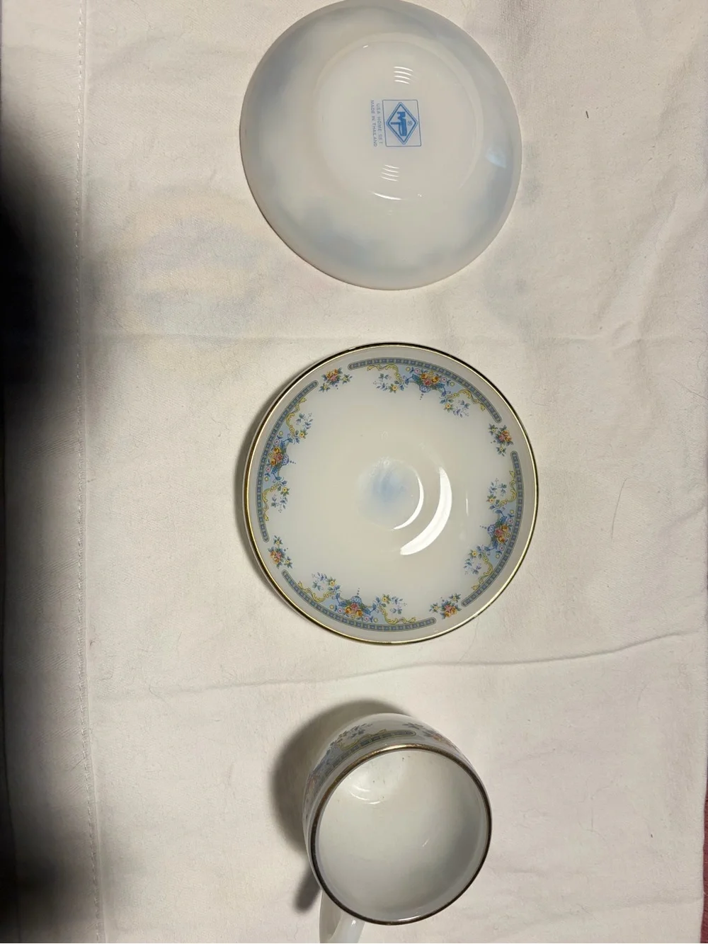 Porcelain Teacup and Saucer Set in White with Blue Floral Trim